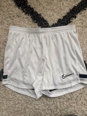 Nike Women's White Athletic Shorts with Black Swoosh
